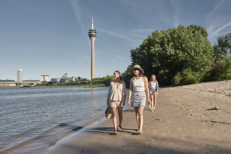 On the Rhine beach in Düsseldorf with the Rhine Tower in the background