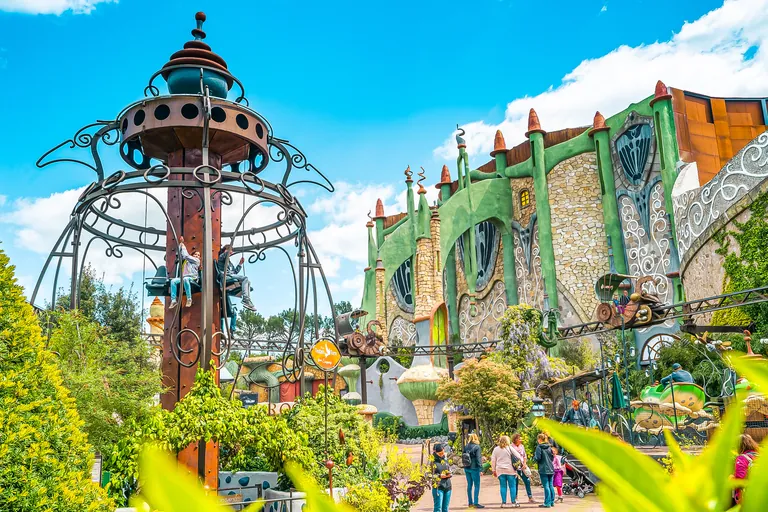 Colourful Fantasy themed area at Phantasialand with tower and fairy-tale facade